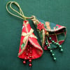 2 stitched textile hanging decorations