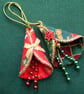 2 stitched textile hanging decorations