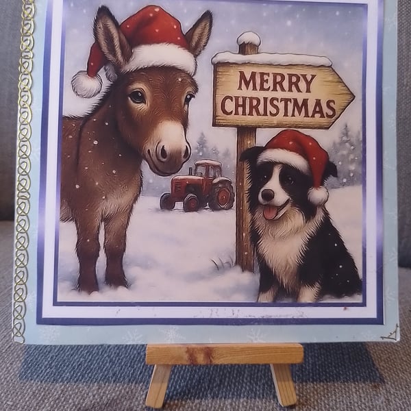 A dog and donkey in the snow