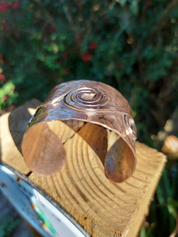 Hammered copper cuff with spiral detail 