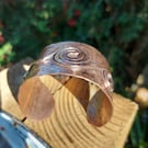 Hammered copper cuff with spiral detail 