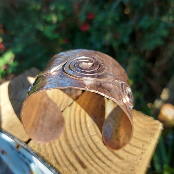 Hammered copper cuff with spiral detail 