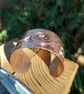 Hammered copper cuff with spiral detail 