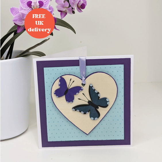 Pretty handmade card with butterfly detachable wooden heart keepsake decoration 