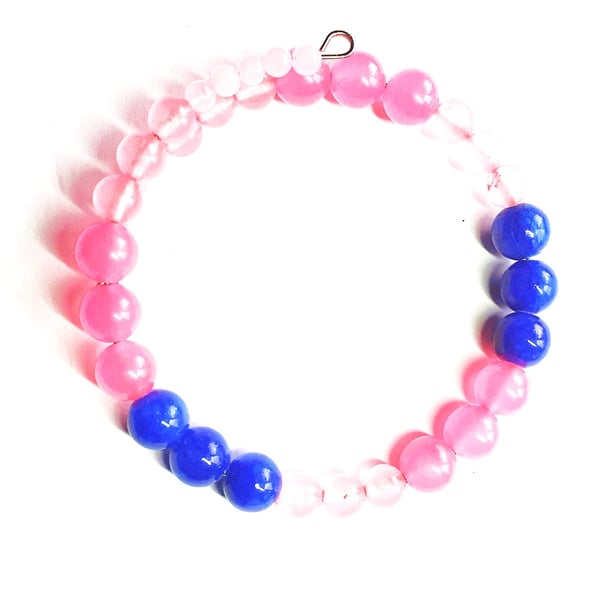 Paradise pink, baby pink jade beads and midnight blue fossil beads.