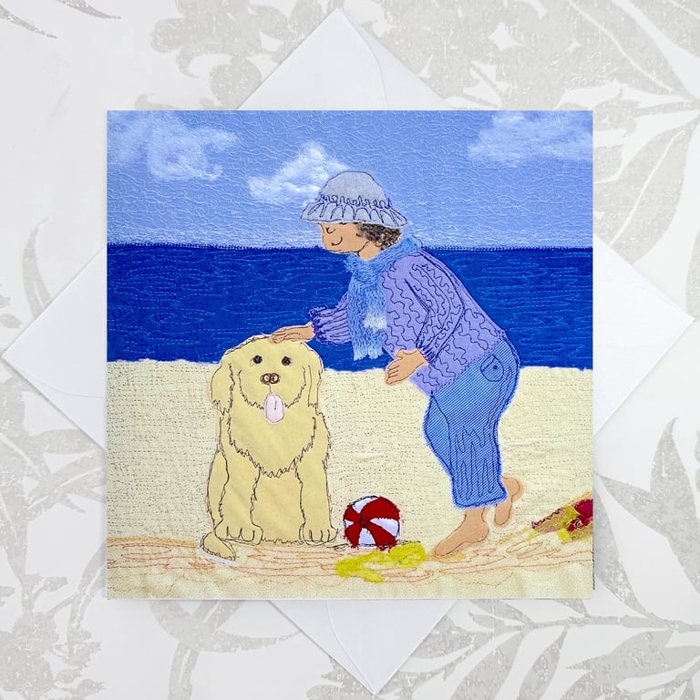 Birthday card with dog on beach by seaside