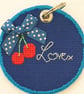 Cherry round keyring with 'Love' quote - Image 4
