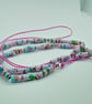 Handmade halloweiner pastel pink and blue varnished paper bead necklace - Image 1
