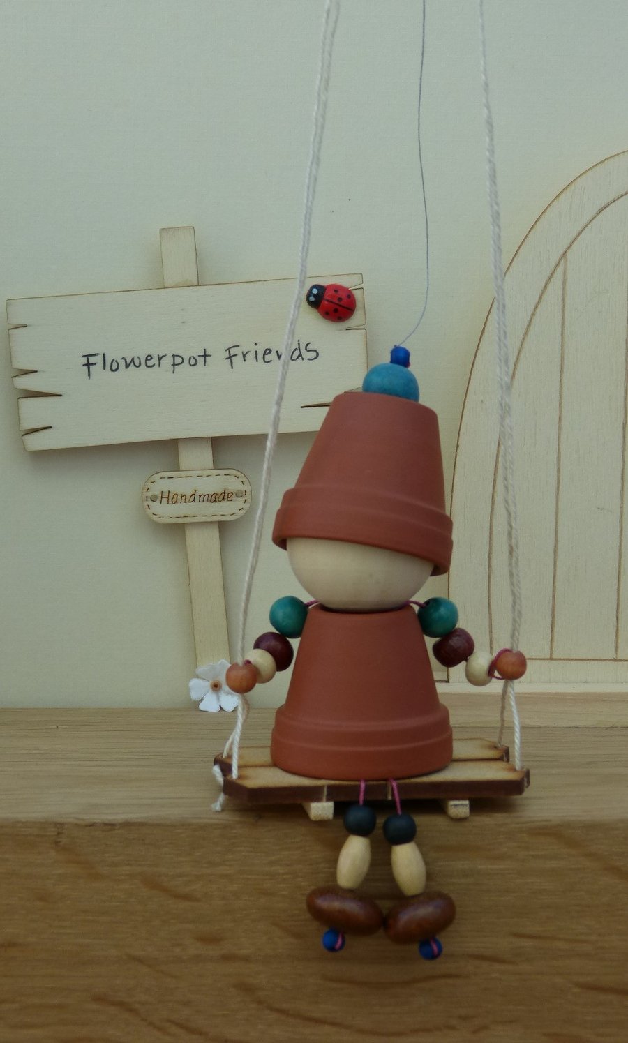 Flowerpot Friend - A swing in the garden