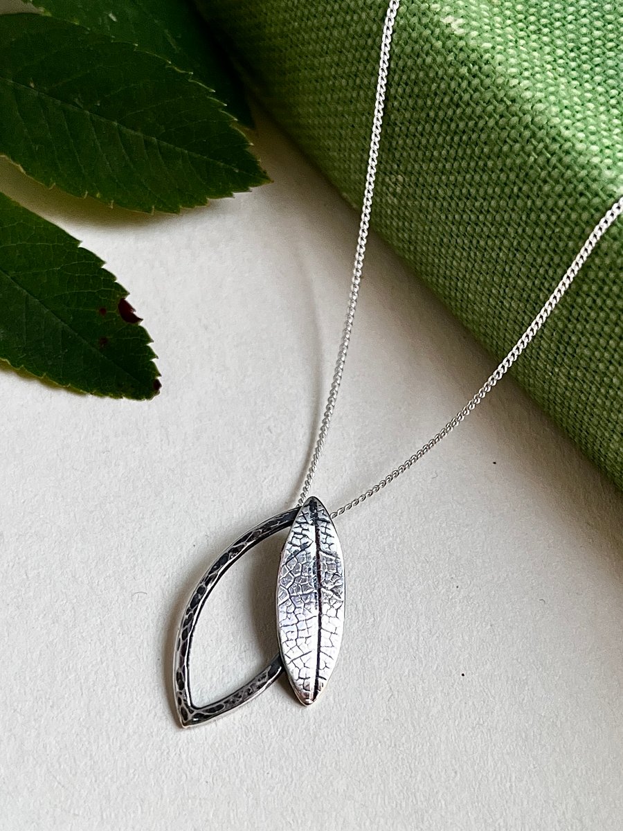 Double leaf sterling silver necklace pendant with printed and hammered texture