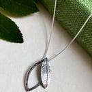 Double leaf sterling silver necklace pendant with printed and hammered texture