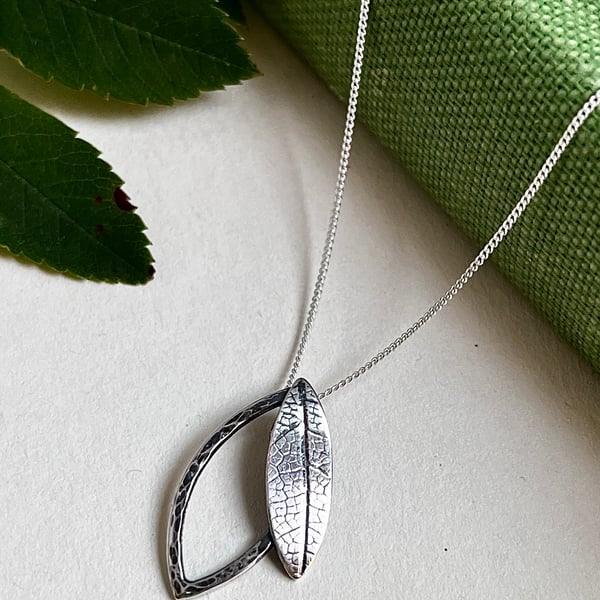 Double leaf sterling silver necklace pendant with printed and hammered texture