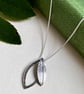 Double leaf sterling silver necklace pendant with printed and hammered texture