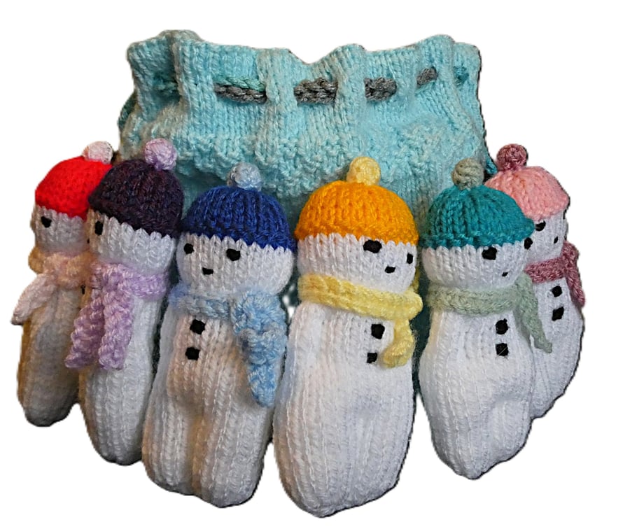 Handmade knitted snowmen in drawstring bag