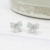 Titanium posts, Silver holographic glitter bow studs