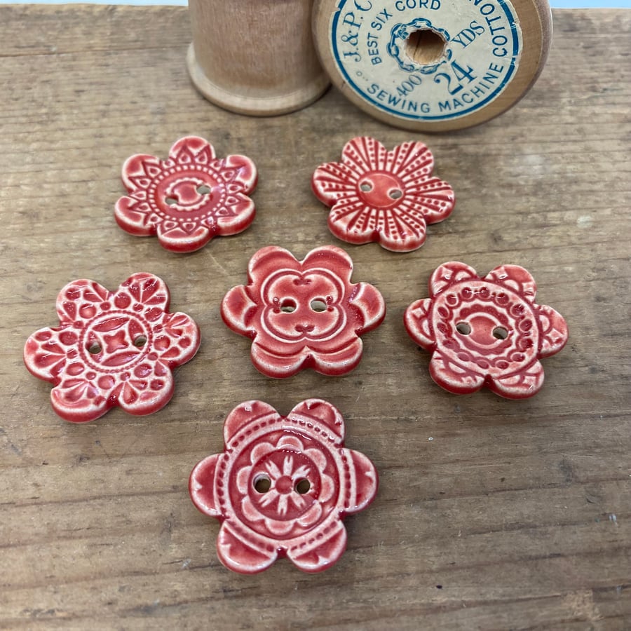 Set of six flower shaped ceramic handmade buttons red