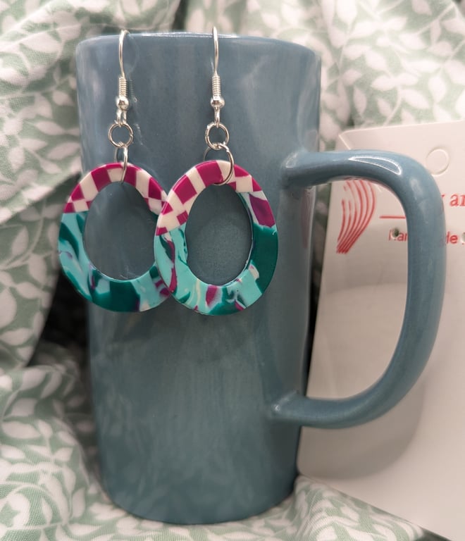Magenta and teal drop earrings.