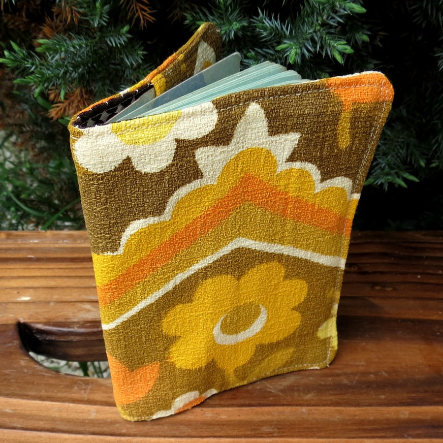 A passport sleeve, made from a groovy 1960s barkcloth fabric.