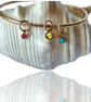 Gold Textured Bangle With Gemstone Charms - Image 1