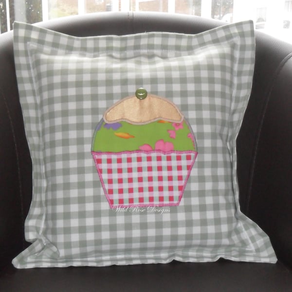 Cushions with appliqued cupcake. 