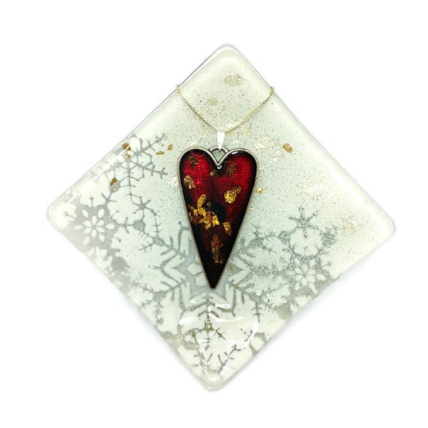 Heart necklace resin with gold and copper leaf.