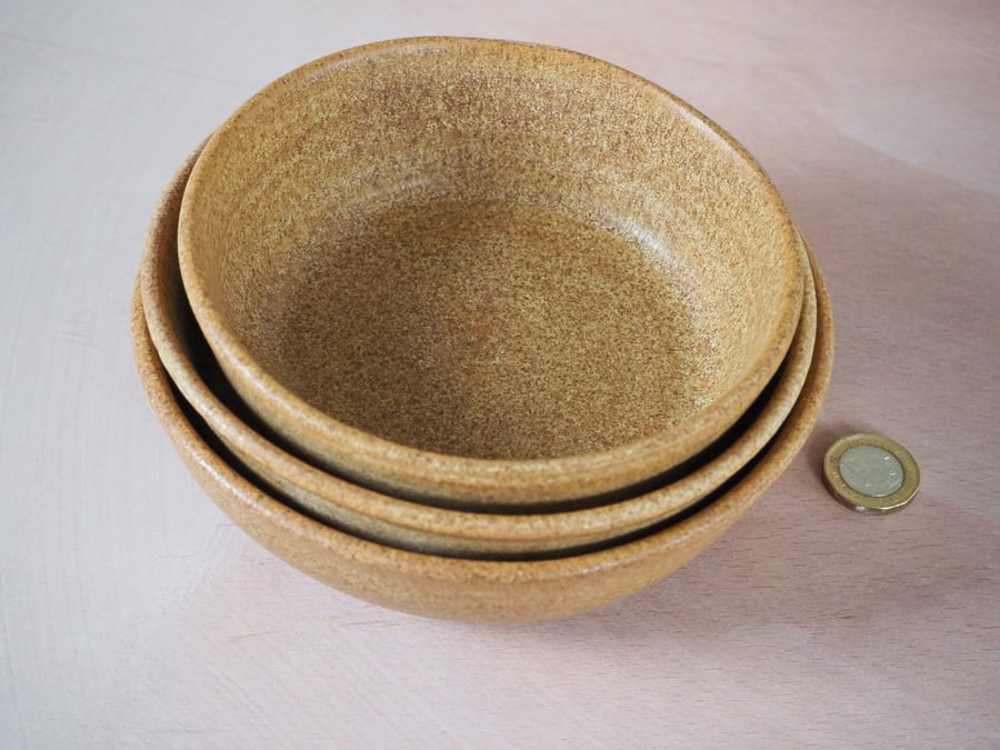 Three stacking bowls in a toasty natural sand colour. Handmade.