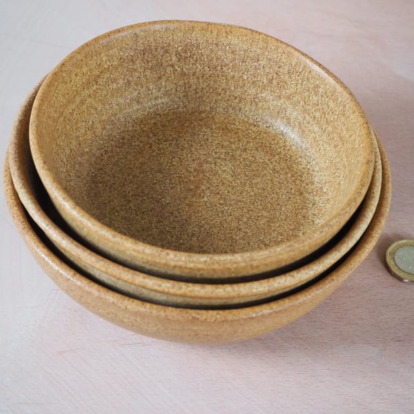 Three stacking bowls in a toasty natural sand colour. Handmade.