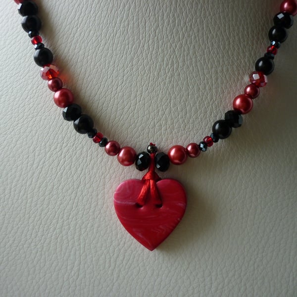 RED AND BLACK HEART NECKLACE.  783