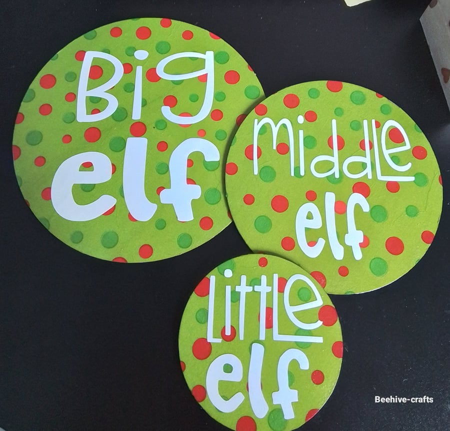 Wooden elf coaster trio