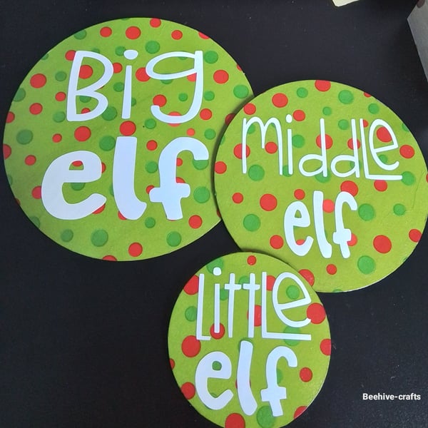 Wooden elf coaster trio