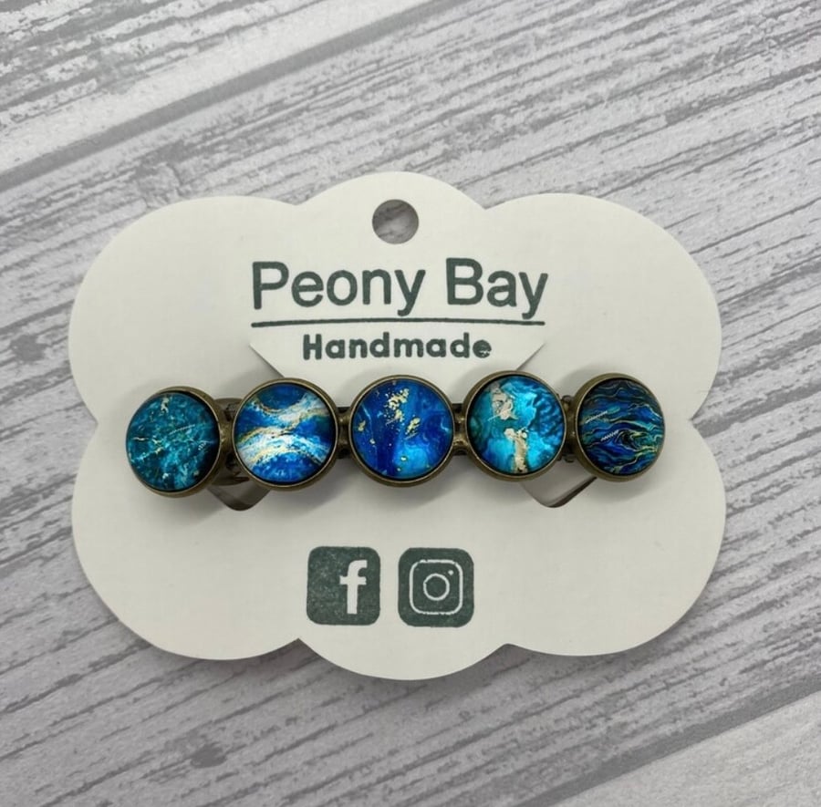 Women's barrette in blue and gold