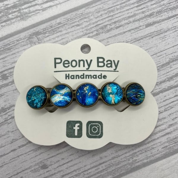 Women's barrette in blue and gold