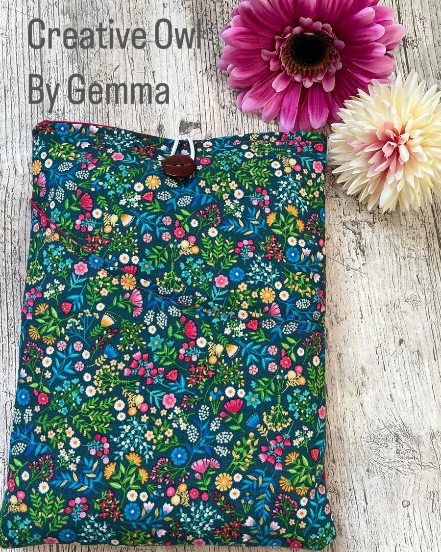 Fabric book sleeve with pocket for paperback books. Padded and fully lined. 