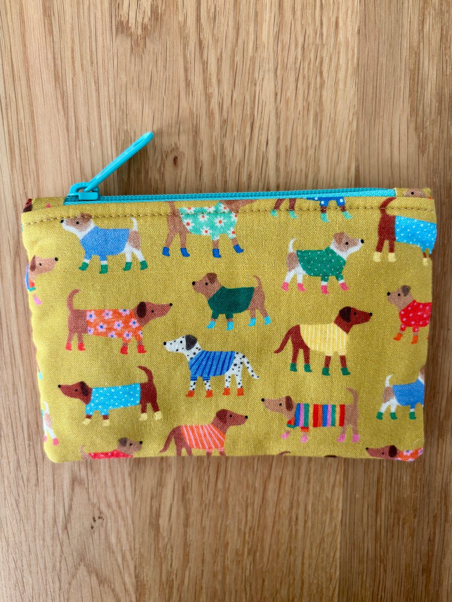 Small zipped fabric purse, pouch, make up bag, gold with fun dogs print.