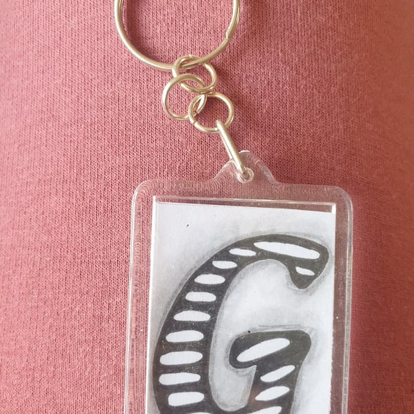 Hand drawn initial "G" keyring.