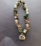 Elasticated moss agate and assorted bead bracelet with silver pumpkin charm  - Image 1
