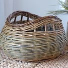 A handmade willow basket for storage or interior decoration