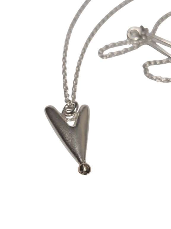 Solid silver heart with gold detail