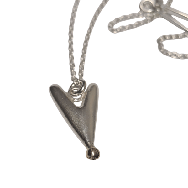 Solid silver heart with gold detail