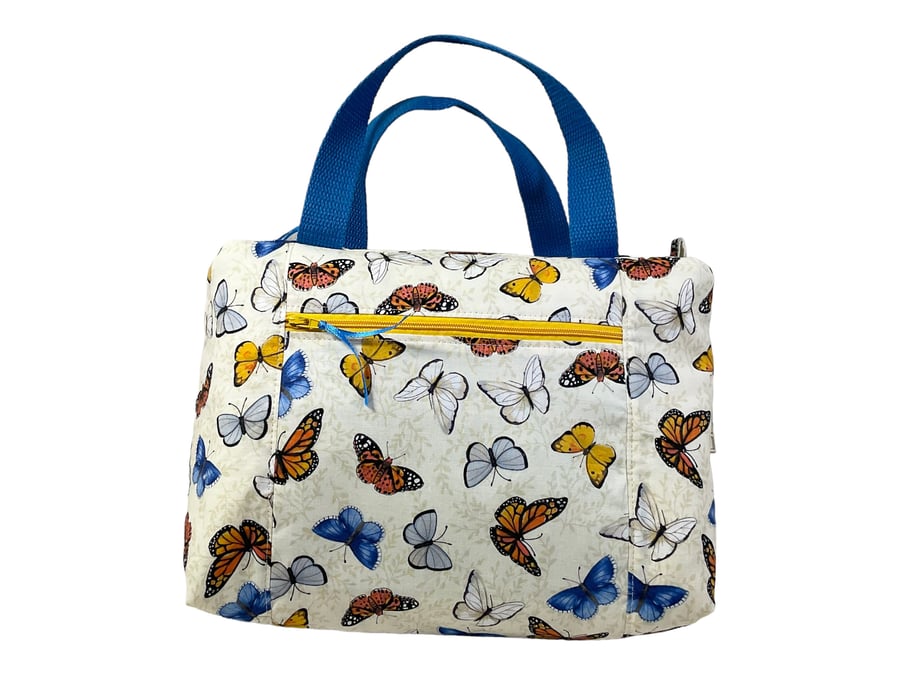Large wash bag in butterfly print, toiletries bag with handles and pocket.