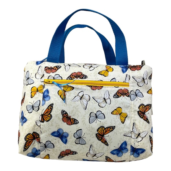 Large wash bag in butterfly print, toiletries bag with handles and pocket.