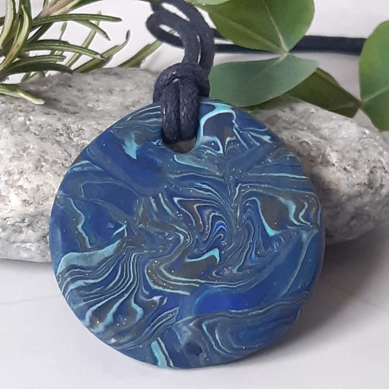 Round blue polymer clay pendant