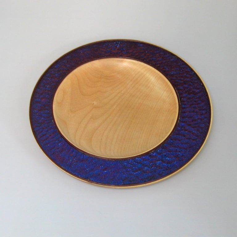 An iridescent, dappled platter