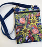 Flower cross body bag with long strap. 