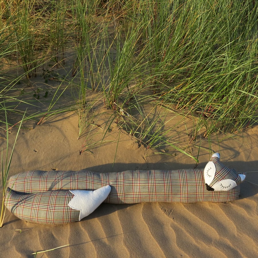 A tartan fox draught excluder.  Pure new wool.
