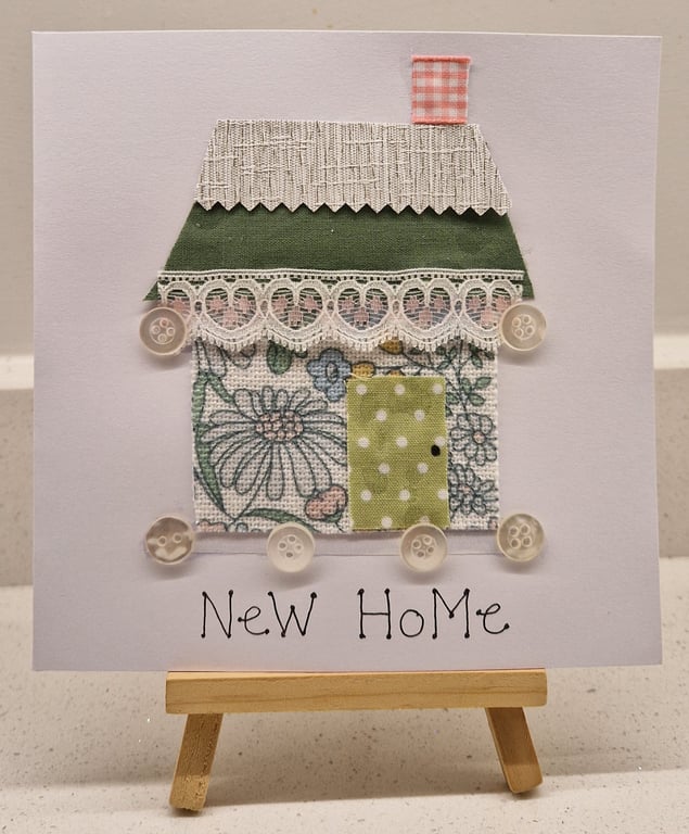 New Home card with a house of fabric & buttons pastel green & pale pink