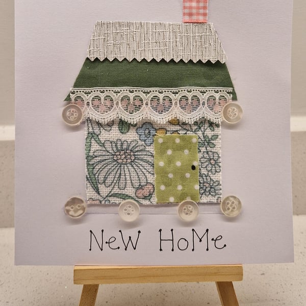 New Home card with a house of fabric & buttons pastel green & pale pink