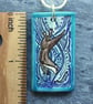 Handmade Ceramic Otter pendant in turquoise blue - Image 4