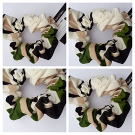 Scrunchie made in cream, green and black fabric.  