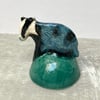 Badger candle snuffer ornament